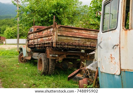 Old rusty truck and bus