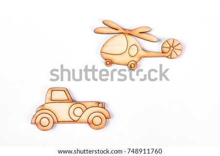 Cardboard helicopter and automobile. Cartoon car and airplane on white background. Natural miniature toys for kids.