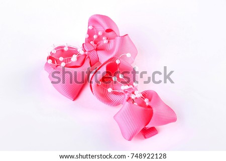 Pair of hair bows on white background. Beautiful pink bow ties isolated on white background.
