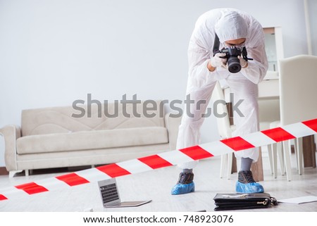 Forensic expert at crime scene doing investigation