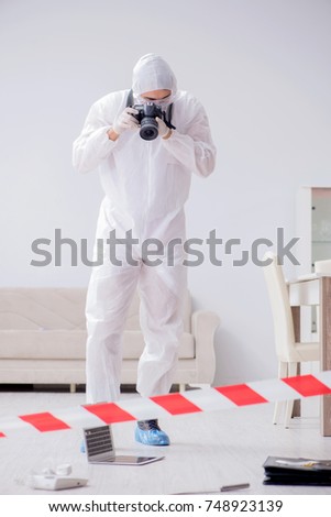 Forensic expert at crime scene doing investigation