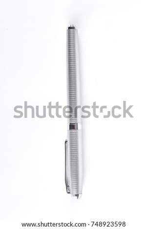 Silver ballpoint pen on white background. Metal silver pen isolated on white background. Luxury business gift.
