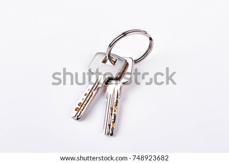 Doors keys isolated on white background. Twor keys on metal keyring isolated on white background. Royalty-Free Stock Photo #748923682