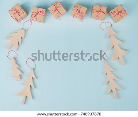 Christmas Festive Gift Box red ribbon,bow,Wooden Xmas Rustic tree,Copyspace, Blue background