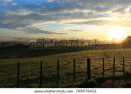 Sunrise over meadows.