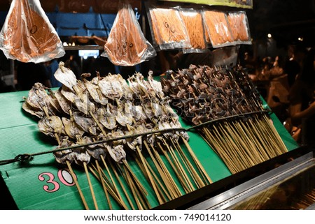 Dried squid for grill at food street in the festival of Thailand.