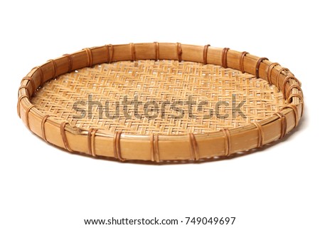 Bamboo basket hand made isolated on white background. Woven from bamboo tray. Royalty-Free Stock Photo #749049697