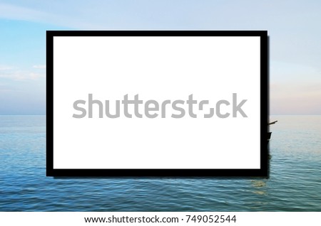 blank advertising billboard or wide screen television on blue sea and sky nature background, copy space for display of product presentation, commercial and marketing concept