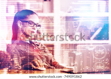 Attractive young woman working on project at abstract workplace with city view and laptop. Lifestyle and work concept. Double exposure 