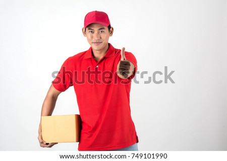 Handsome young delivery man with box isolated on white background.
