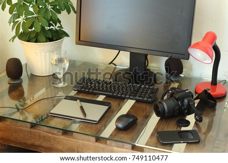 the workplace of the artist, designer, photographer, freelancer. graphic tablet photo camera tools creative man. cozy neat creative environment