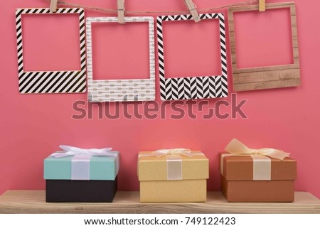 Photo Frame hanging on the rope with pinck color background