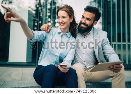 Picture of handsome businessman and attractive businesswoman