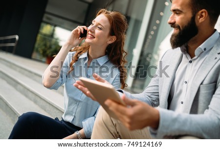 Picture of handsome businessman and attractive businesswoman