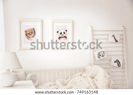 Baby bedroom decorated with pictures of animals