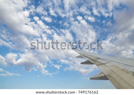 Morning blue sky with wing of an airplane perfect for tourism operators or travel websites picture for add text message or frame website. Traveling concept around the world