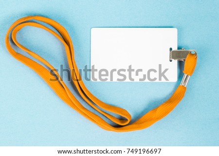 Empty ID card / icon with an orange belt, on a blue background. Space for text.