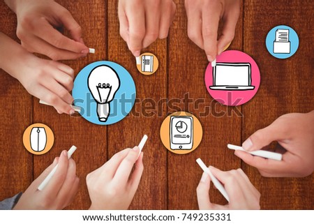 Business people writing with chalks against wooden background 