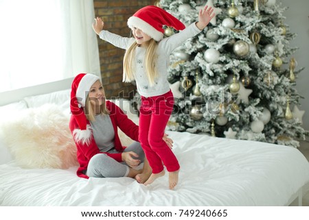 A woman with a child on Christmas 
