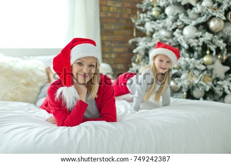 A woman with a child on Christmas