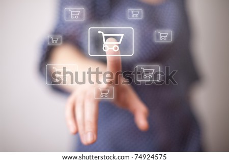 woman hand pressing shopping cart icon