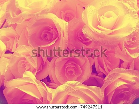 Pink roses are made from paper used in weddings or given to loved ones.