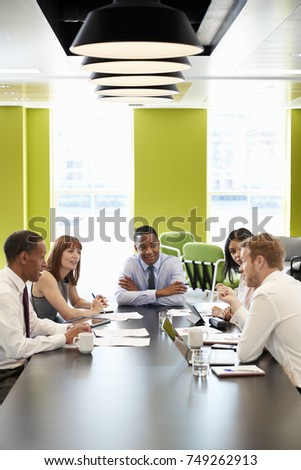 Business colleagues at an informal meeting, vertical