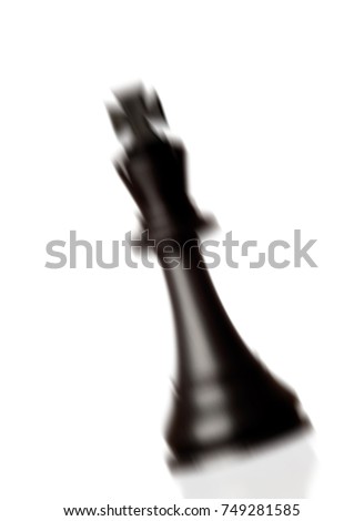 Chess piece king falling isolated on a white background 
