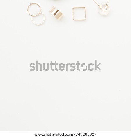 Minimalist fashion photography. Minimal style. Top view accessories for woman. Jewelry concept. Fashionable female accessories watch. Overhead of essentials for any girl