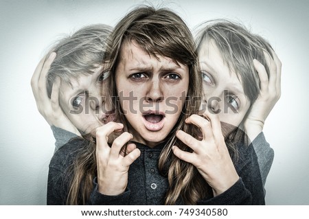 Woman with split personality suffers from schizophrenia - schizophrenia disease concept Royalty-Free Stock Photo #749340580