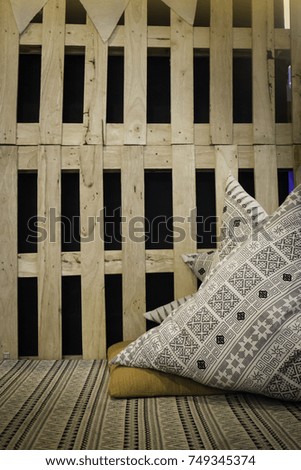 Handmade pillows setting on relax corner, stock photo
