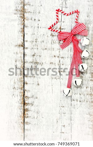 Red Christmas star on white wooden background