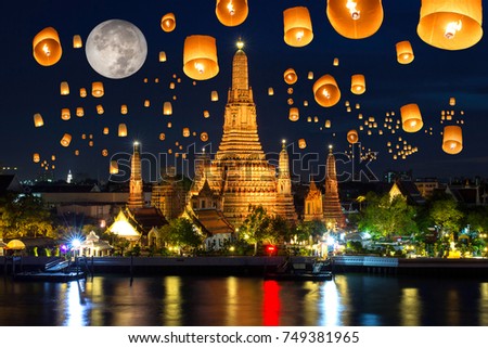 Floating lamp in yee peng festival under loy krathong day at wat arun, Full moon at night in bangkok city, Thailand