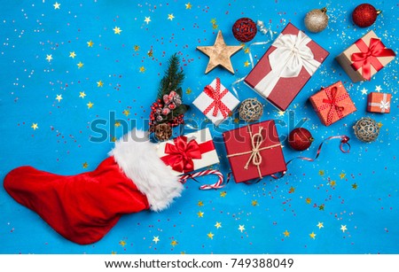 Christmas presents flowing out of Santa's stocking