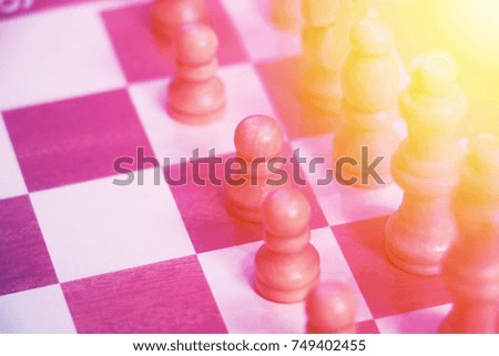 Wooden chess board on table background