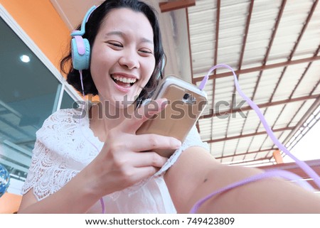 Asian woman listen to headphone