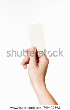 A man holding a business card