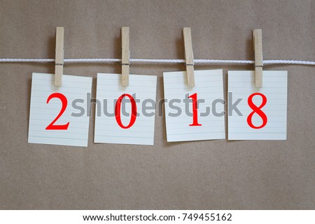 Paper hanging on a rope and have 2018 text for design background in New Year concepts is coming soon.