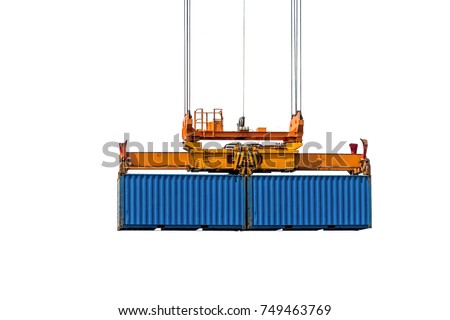 Isolate image twin lift spreaders pick up two container hanging in the sky. Royalty-Free Stock Photo #749463769