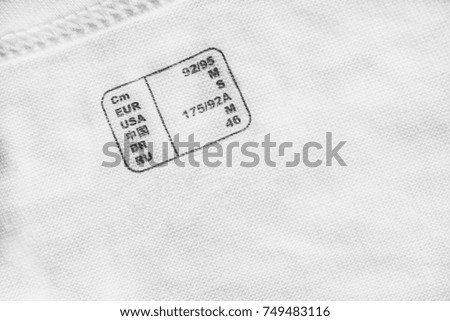 International clothes size table printed on white cotton