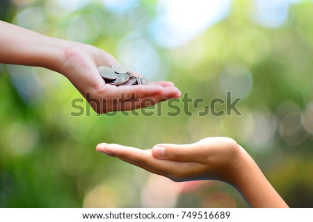 money on hand  philanthropy concept give donate charity finance and grant Royalty-Free Stock Photo #749516689