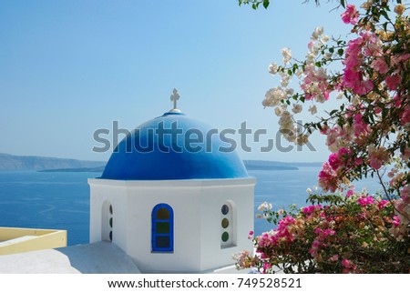 Isolated blue white greek church at Oia Santorini Greece