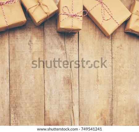 Wooden background with gifts. Selective focus.