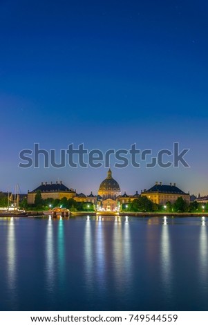 Night view of the Frederik's Church known as The Marble Church and Amalienborg palace with the statue of King Frederick V in Copenhagen, Denmark
