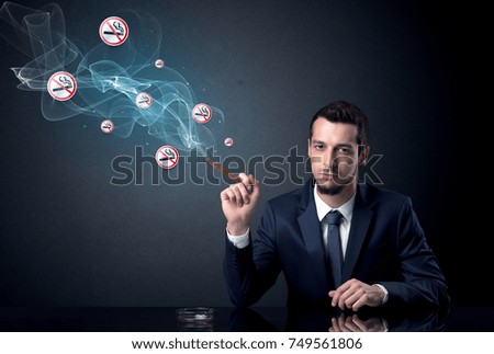 Businessman smoking with floating no smoking signs beside his head.