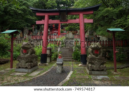 Small shrine of frogs at the Fushimi Inari Shrine, Kyoto, Japan