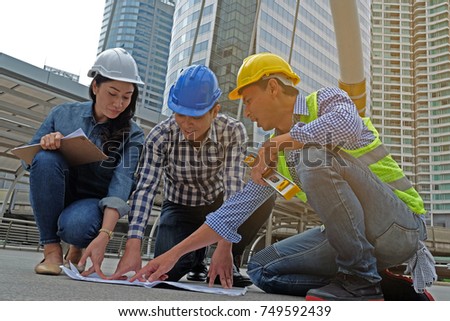 Business people,engineer talking discussing with Architect working with blueprints for architectural plan,engineer sketching a construction project concept.