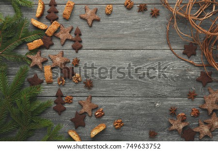 Christmas culinary classes mockup. Baking gingerbread cookies for new year sweet presents and decorations. Biscuits assortment and pine tree branches frame for recipe, top view, copy space