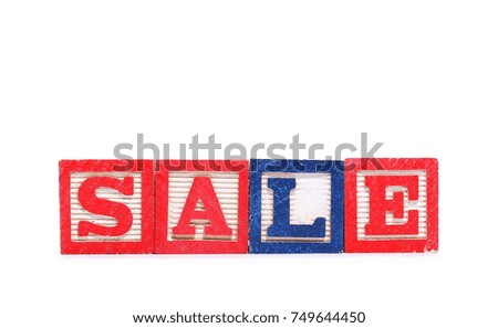 Alphabet blocks, letters spelling out word sale isolated on white background