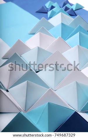 Abstract blue to red paper poly made from tetrahedron background. Usefull for business cards and web.
